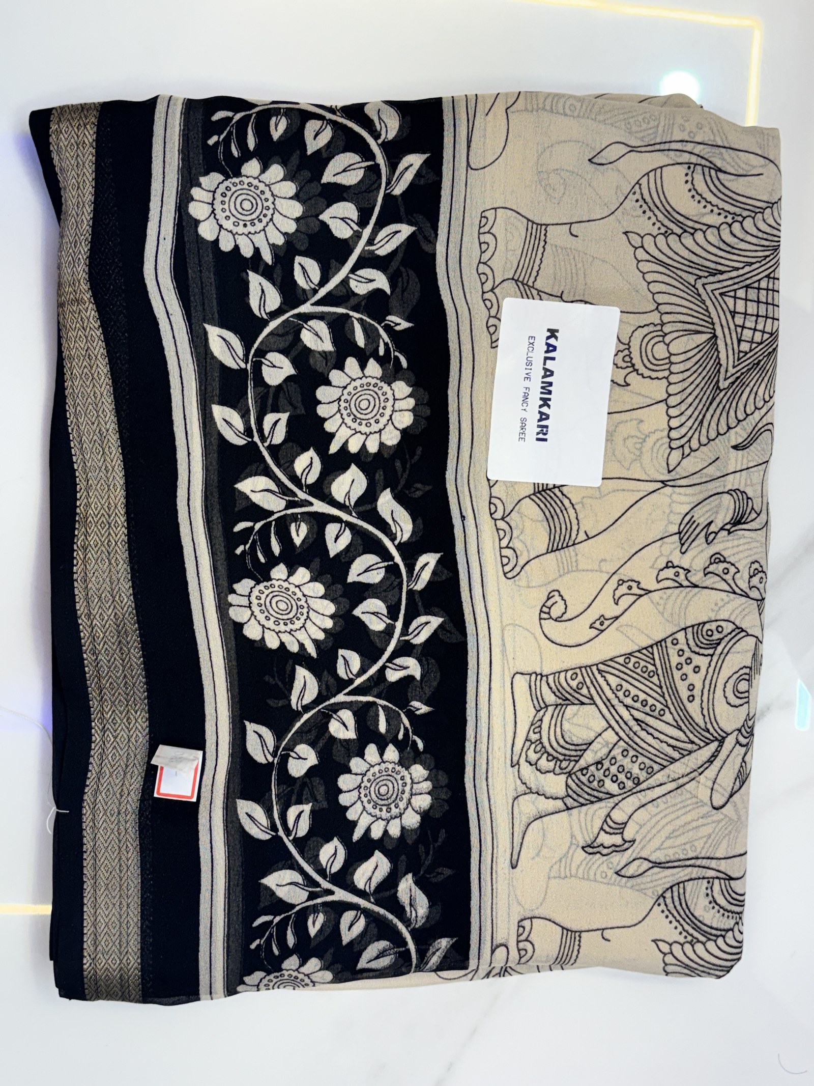 Black and ivory saree with a botanical border
